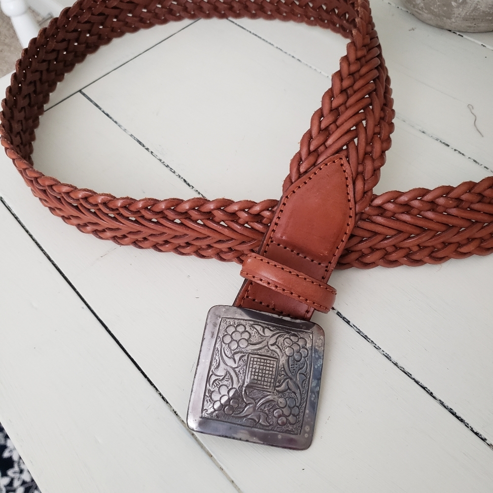 Braided leather buckle belt.